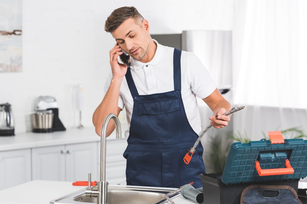 plumbers fixing stubborn clogs