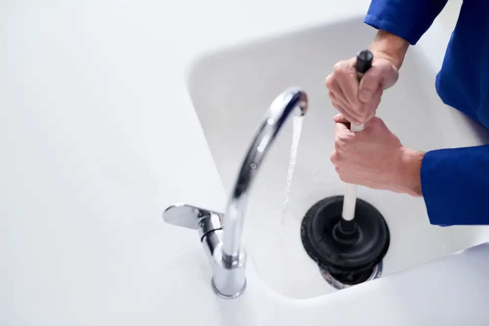 cleaning drain with plunger